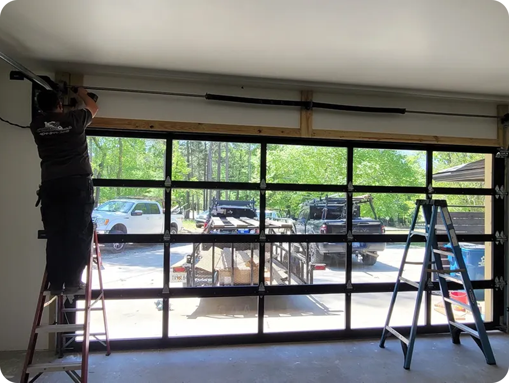 Worker fixing garage door mechanism