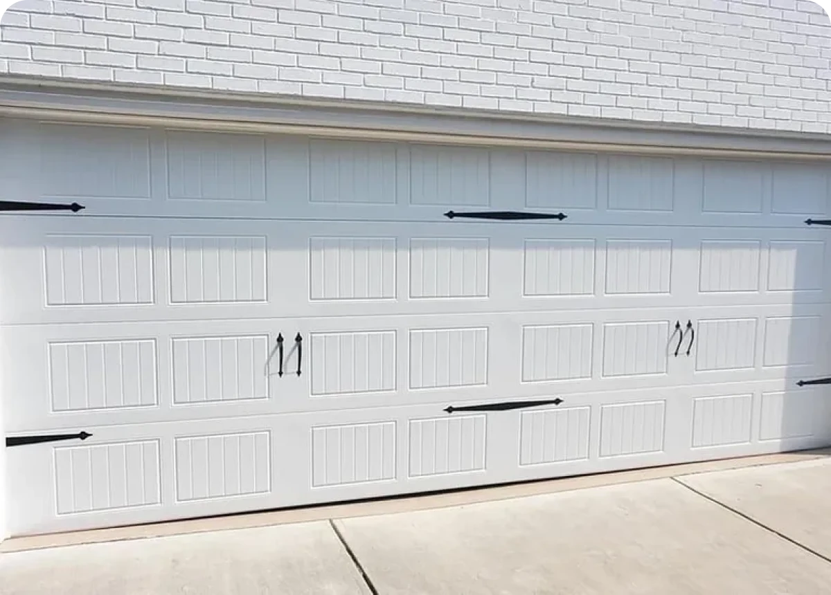 Closed garage door on concrete driveway
