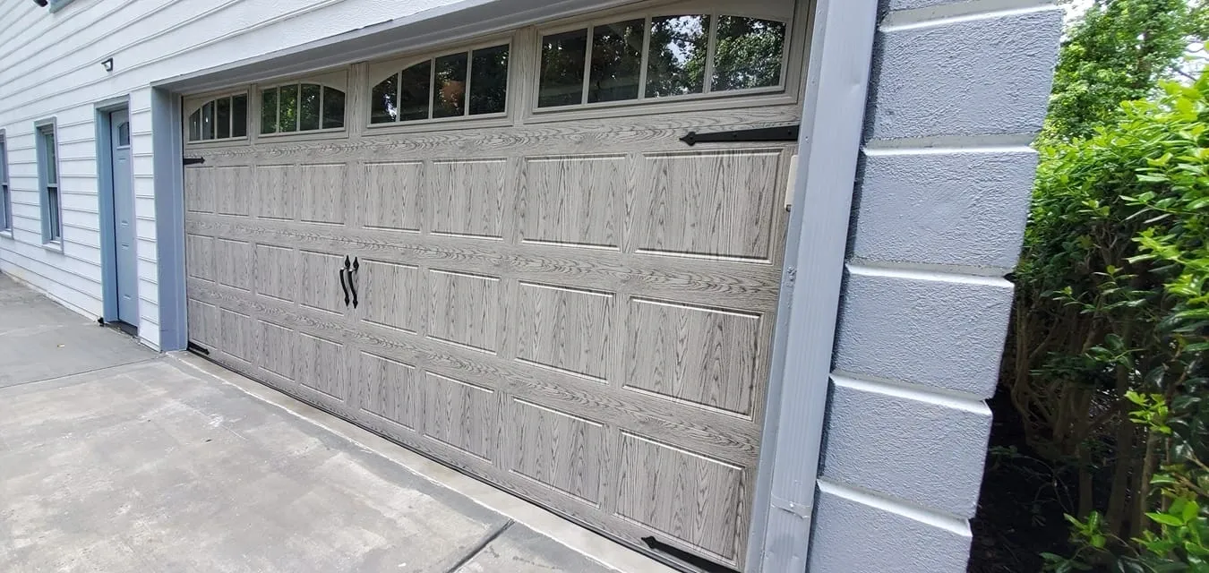 Wooden garage door with windows